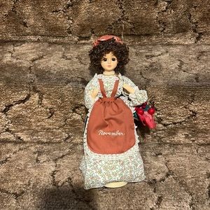 November Musical Calendar Doll What the world needs now